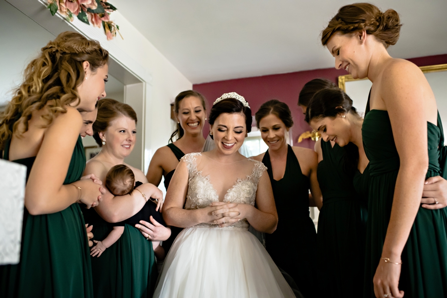 A bride and her bridesmaids pray before going to the church.